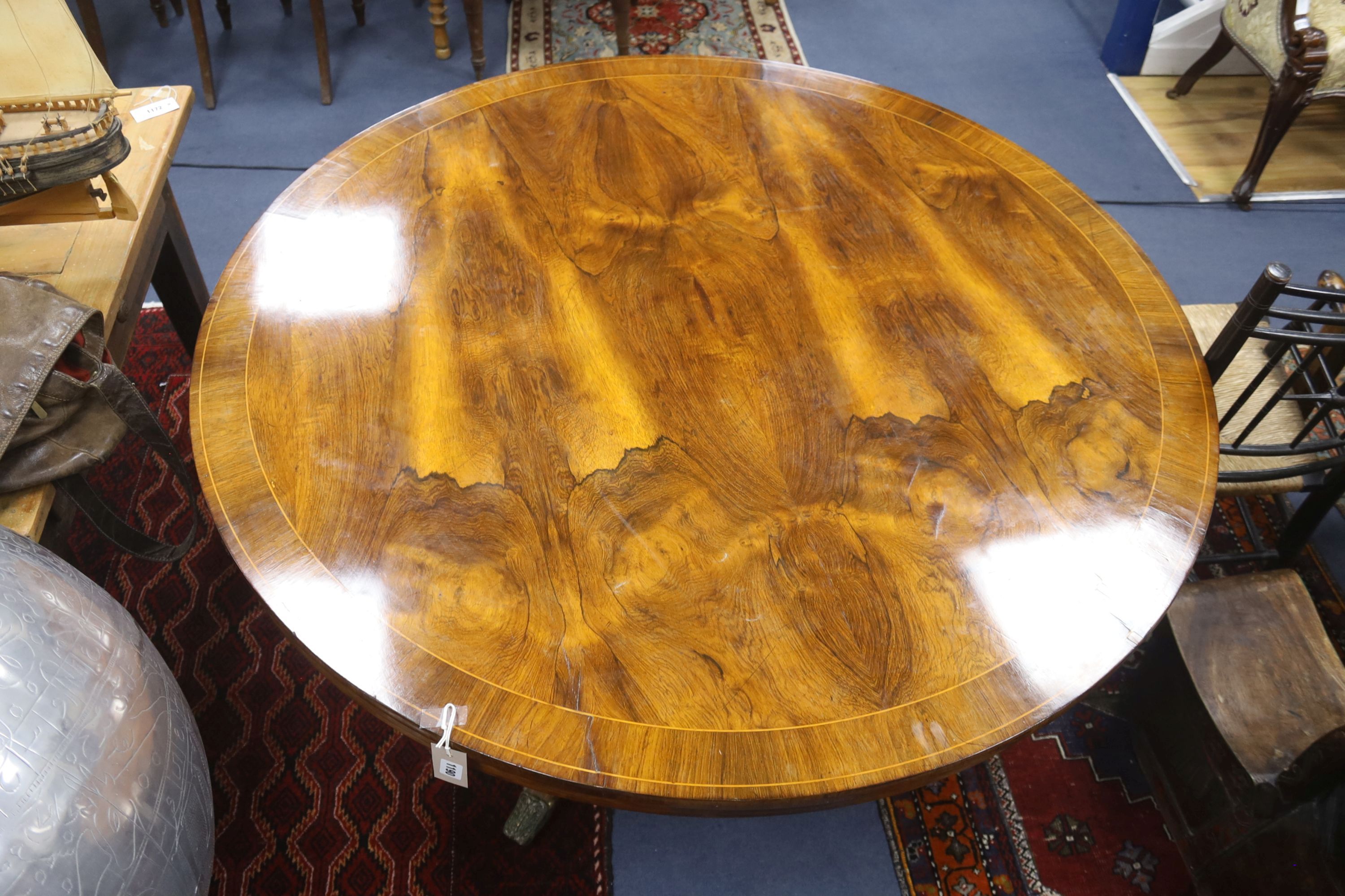 A Regency inlaid rosewood circular tilt top breakfast table, diameter 130cm, height 75cm